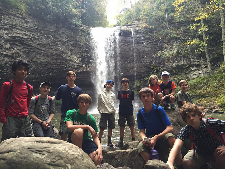 Group of scouts at a waterfall